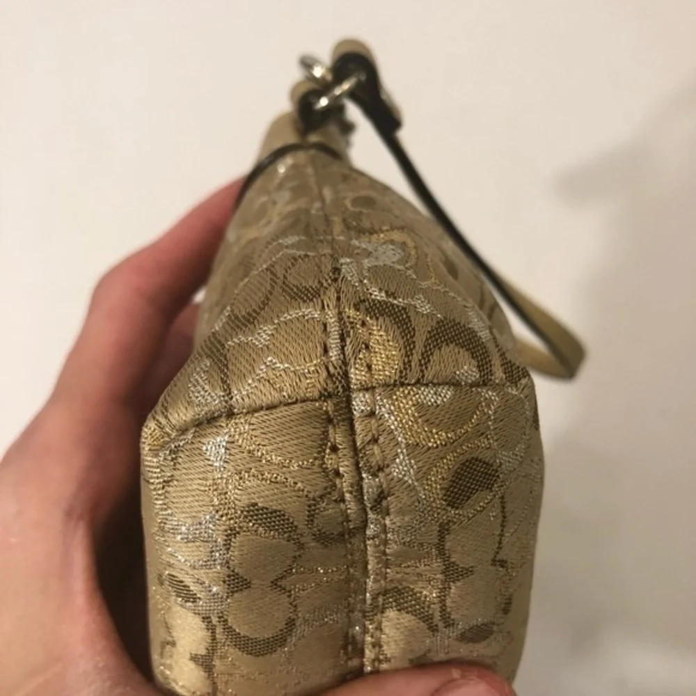 Coach gold optic wristlet